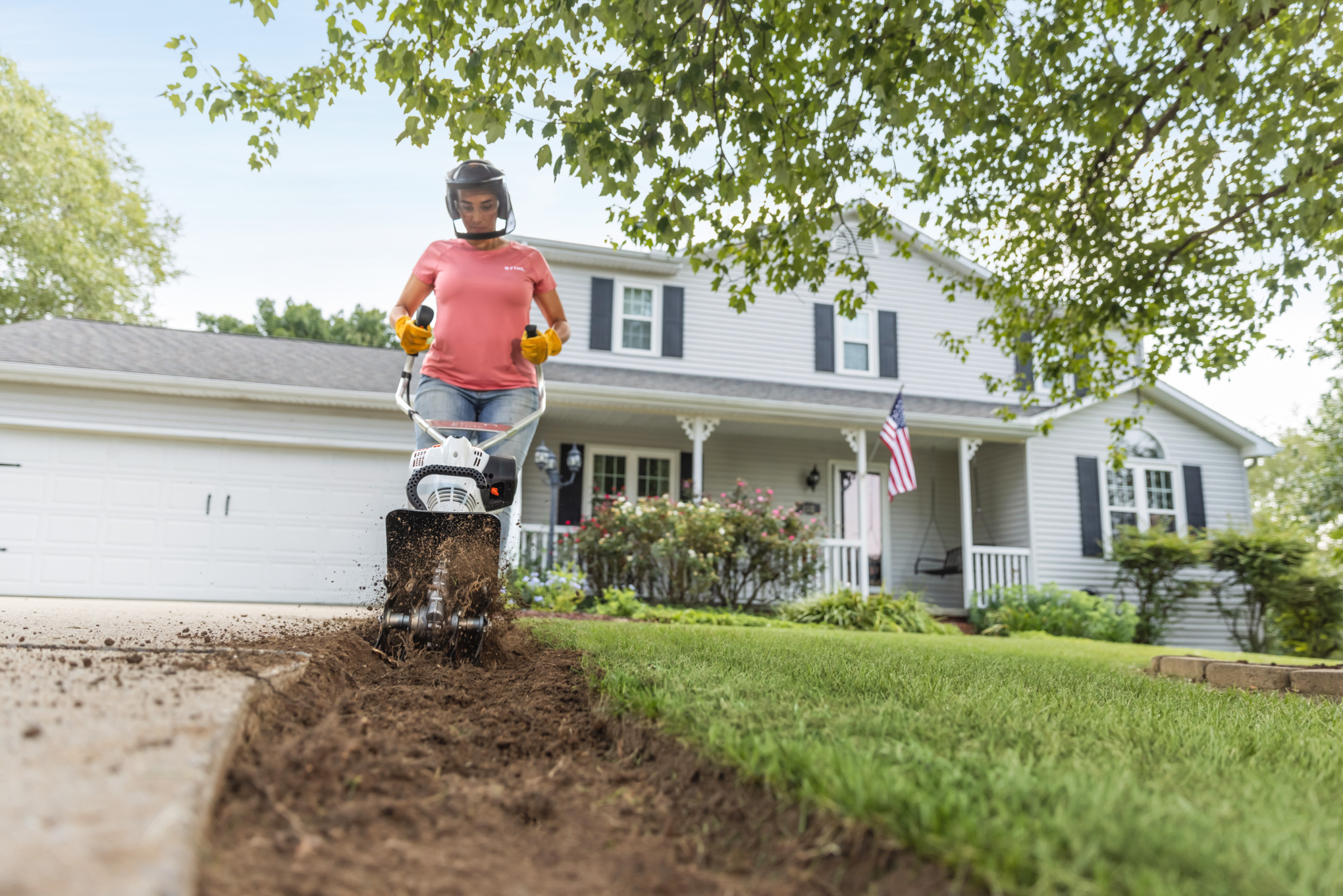 Sara Bendrick loosening dirt with MM 56 C-E Yard Boss®