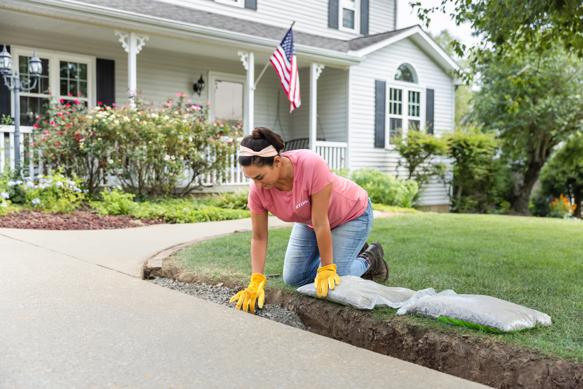 Sara Bendrick laying base gravel.