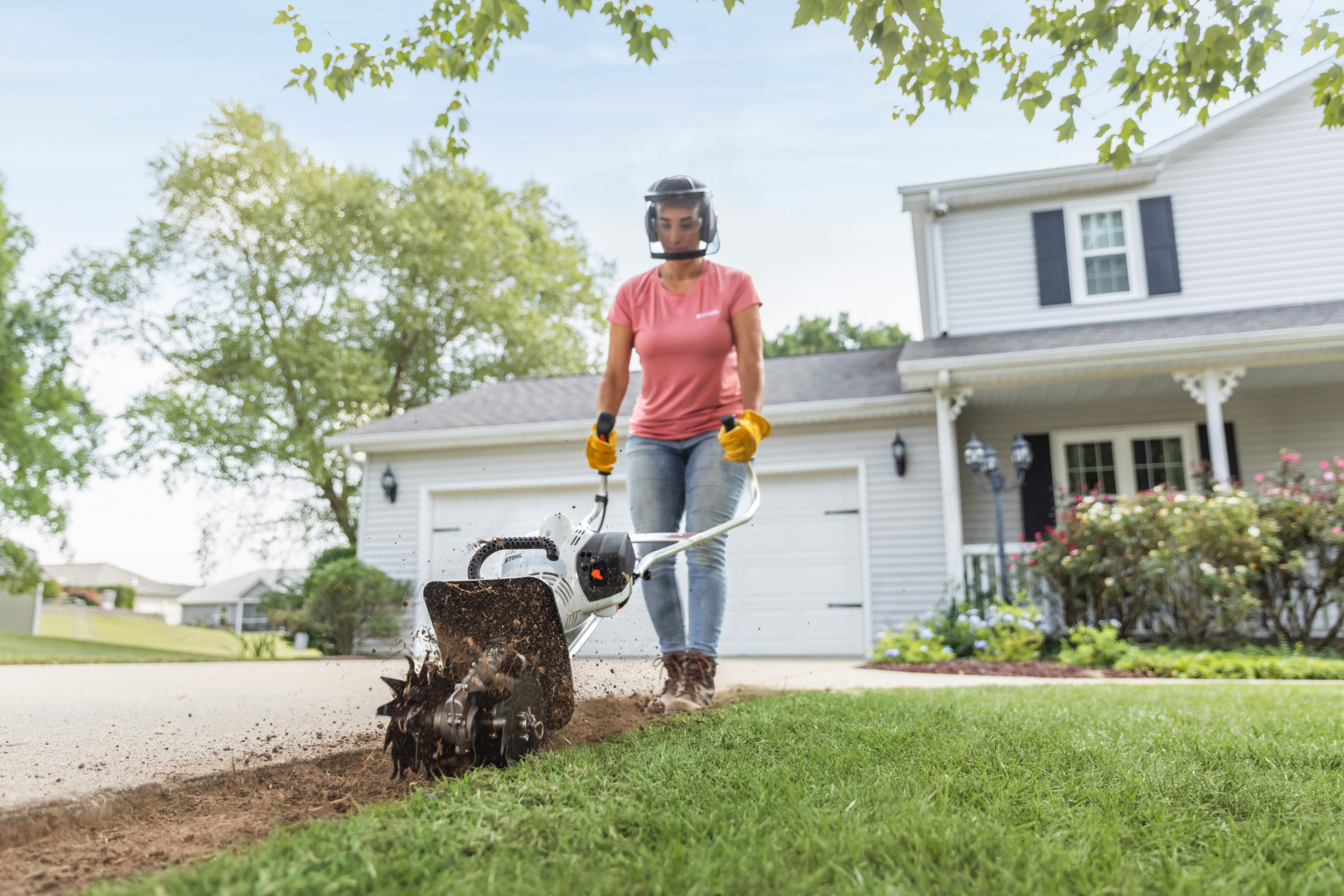 Sara Bendrick Licensed Contractor Using STIHL YARD BOSS® to Prepare Driveway for Pavers
