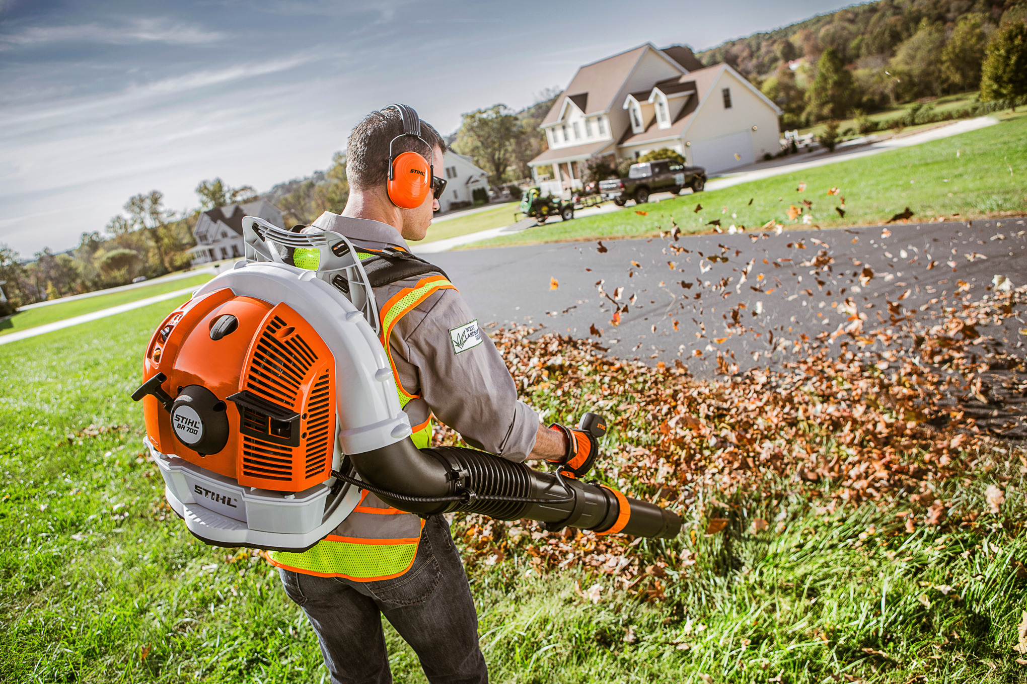 Professional Using STIHL BR 700 Backpack Blower to Blow Leaves Away