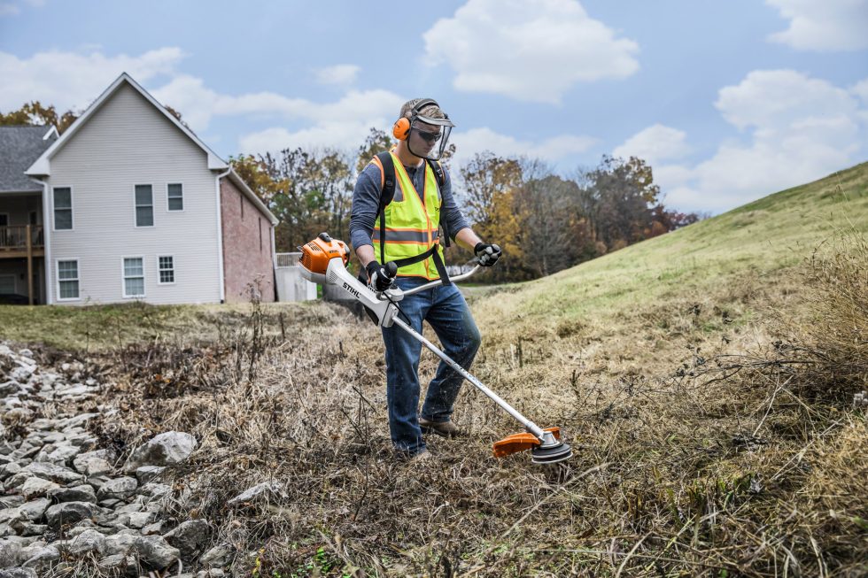 professional landscaper using STIHL FS 360 C-EM brushcutter