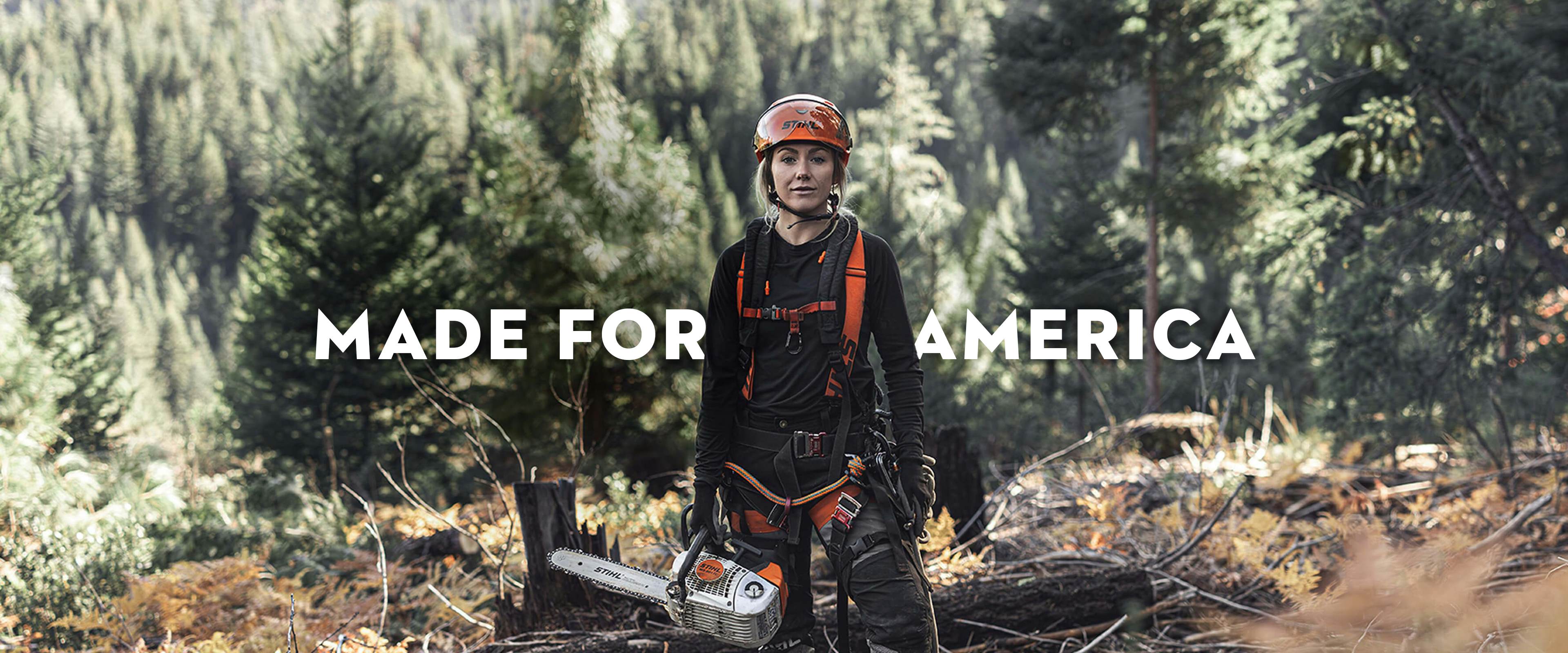 Katelyn Johnson holding professional STIHl chainsaw