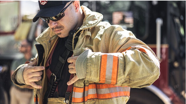 Firefighter puts on jacket