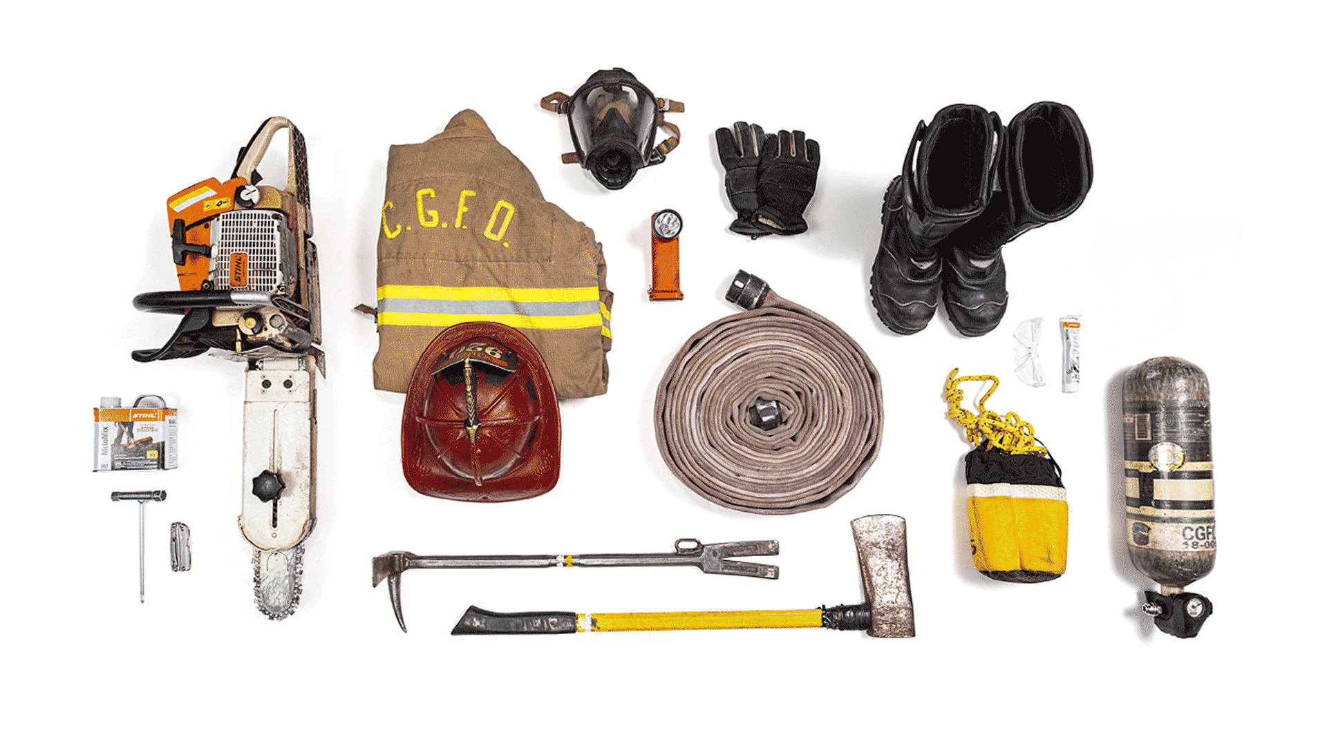 Knolling image of essential firefighter gear including STIHL MS 462 R C-M chainsaw