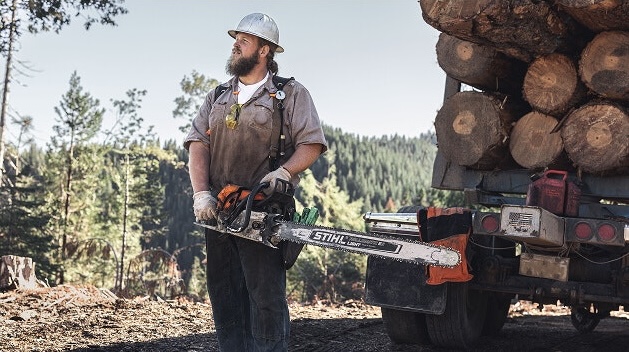 Logger holds STIHL MS 661 C-M MAGNUM® chainsaw