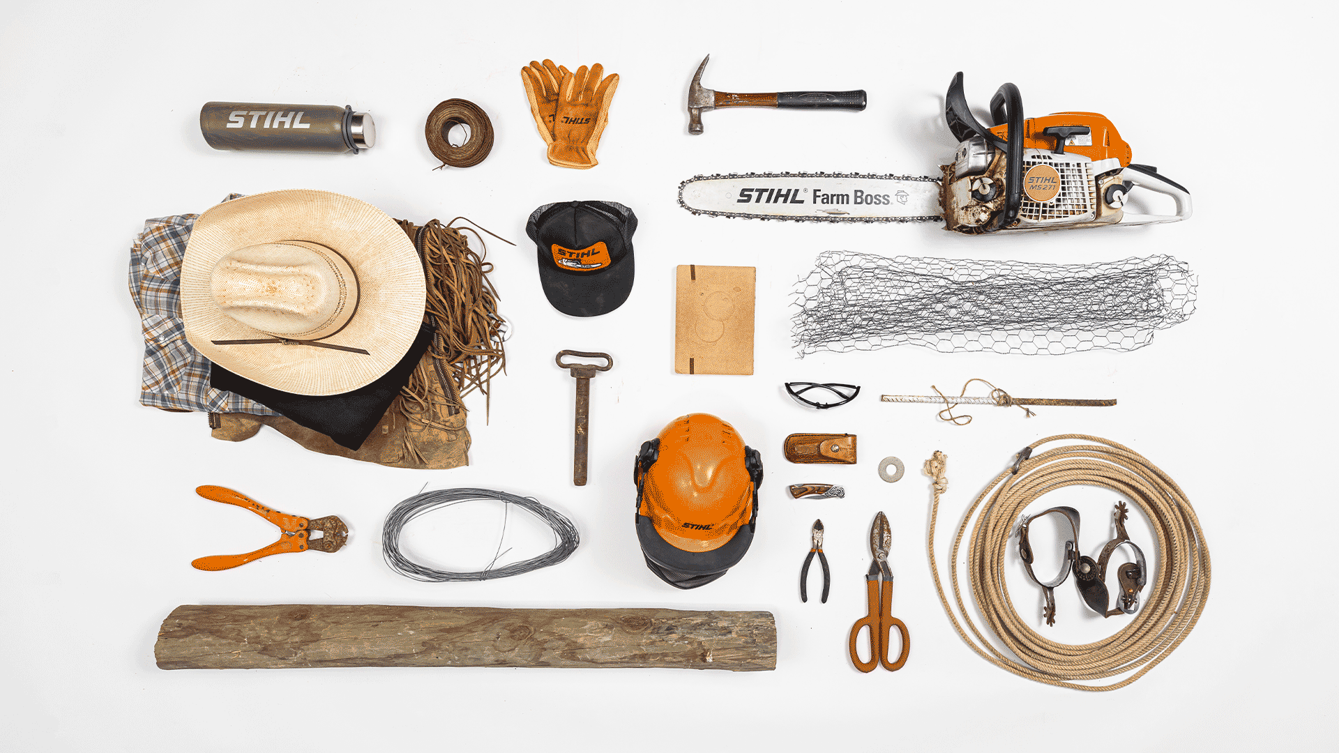 Knolling image of essential rancher gear including STIHL MS 271 FARM BOSS® chainsaw