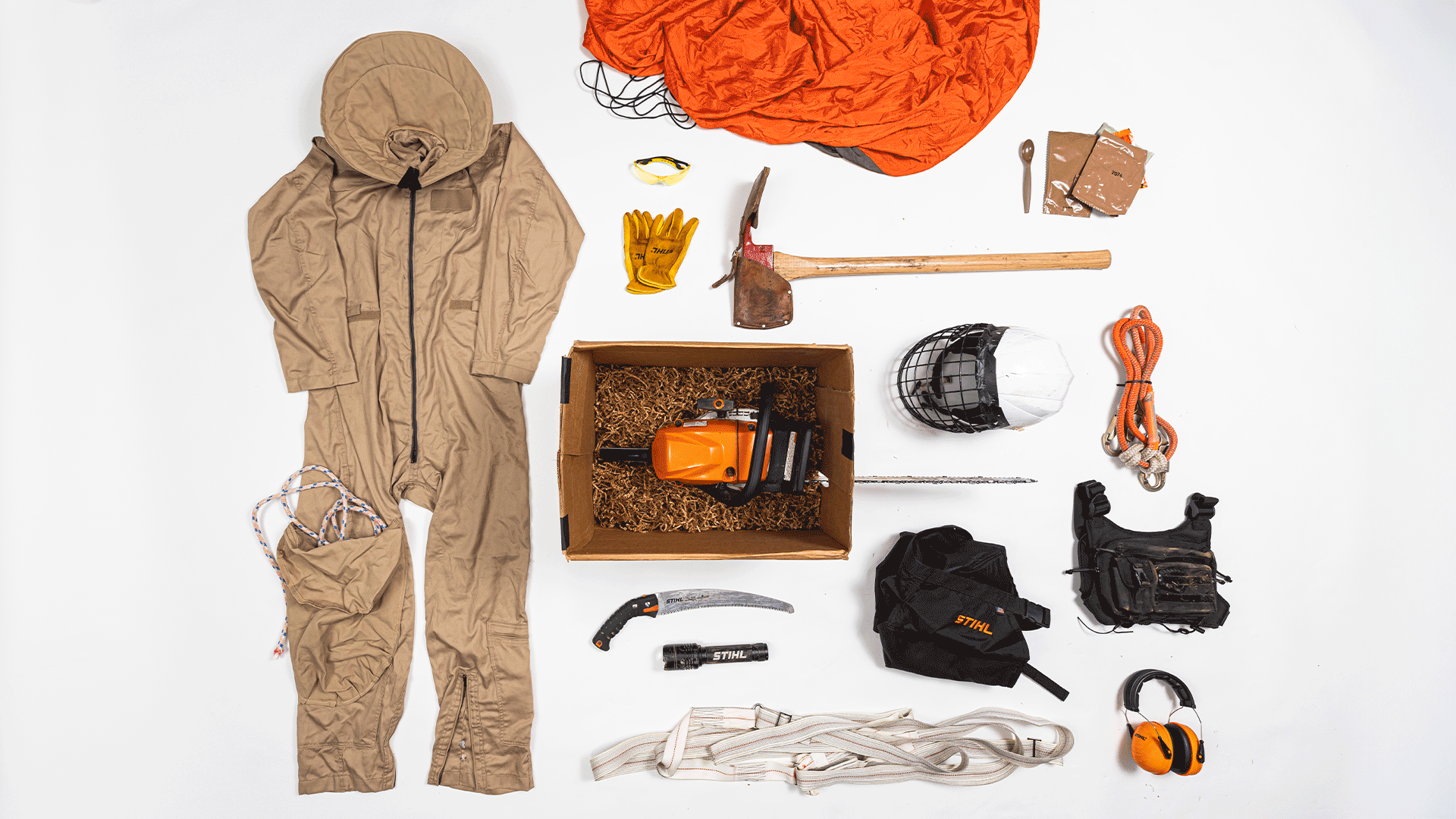 Knolling image of essential smokejumper gear including STHL products
