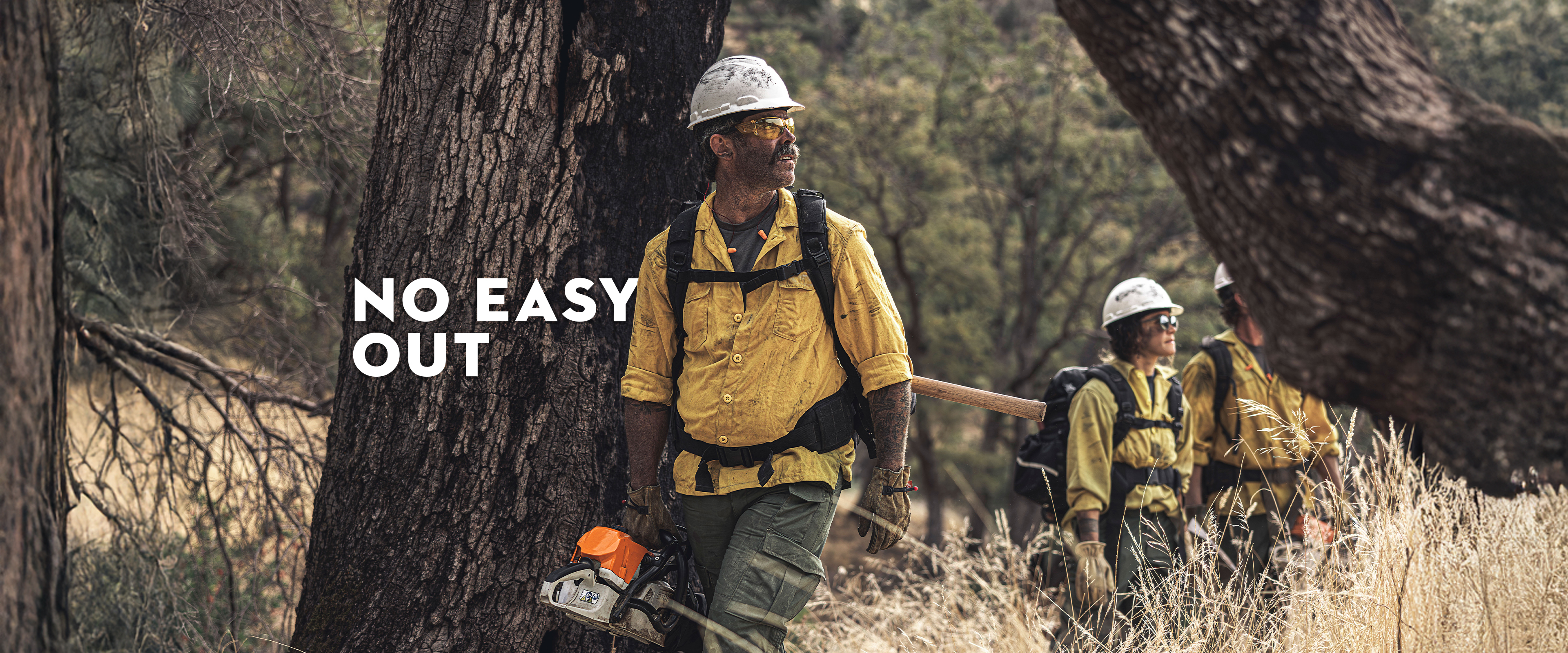 Wildland firefighter holding STIHL chainsaw