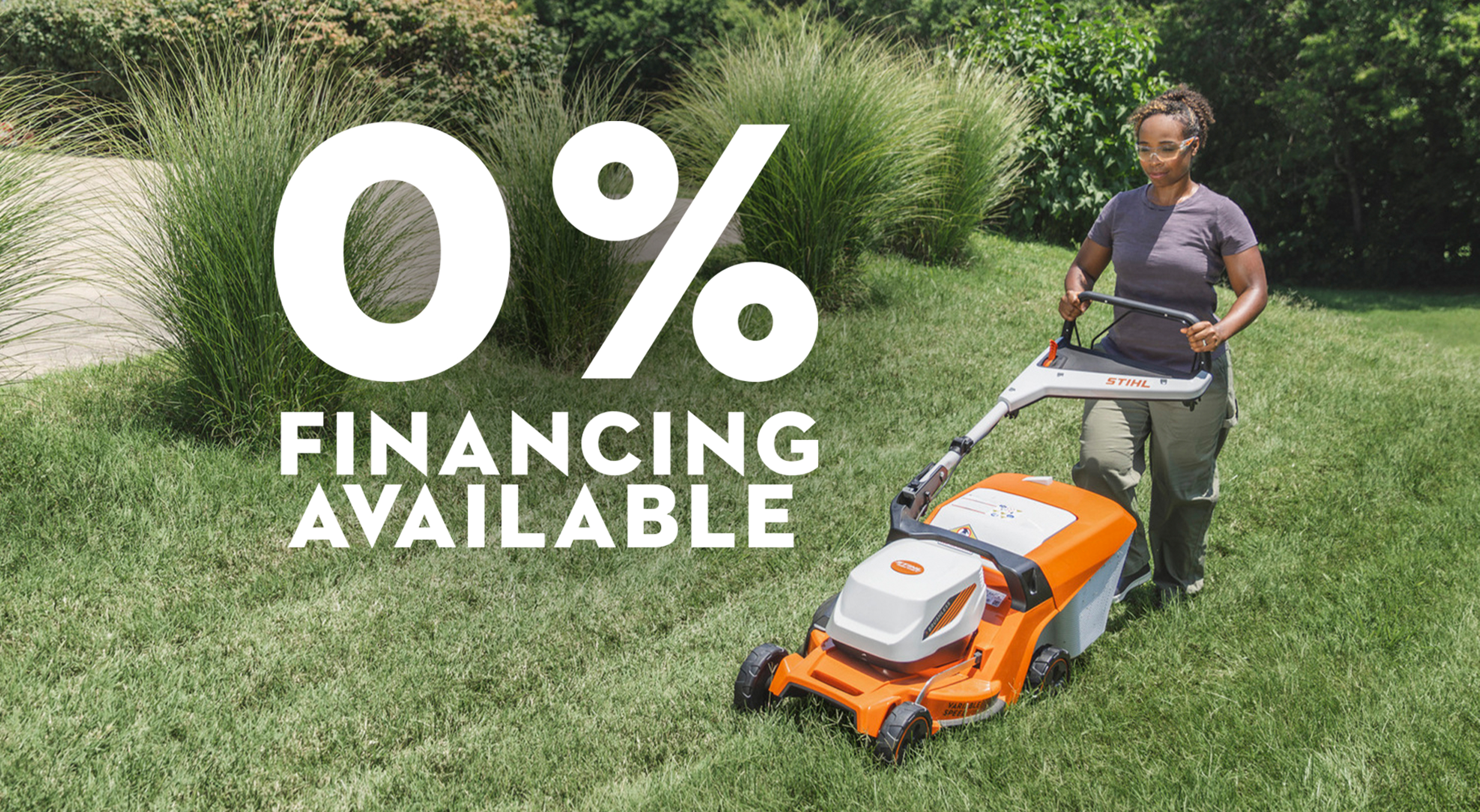 Homeowner mowing a lawn with a STIHL battery-powered push mower beside a 0% financing offer.