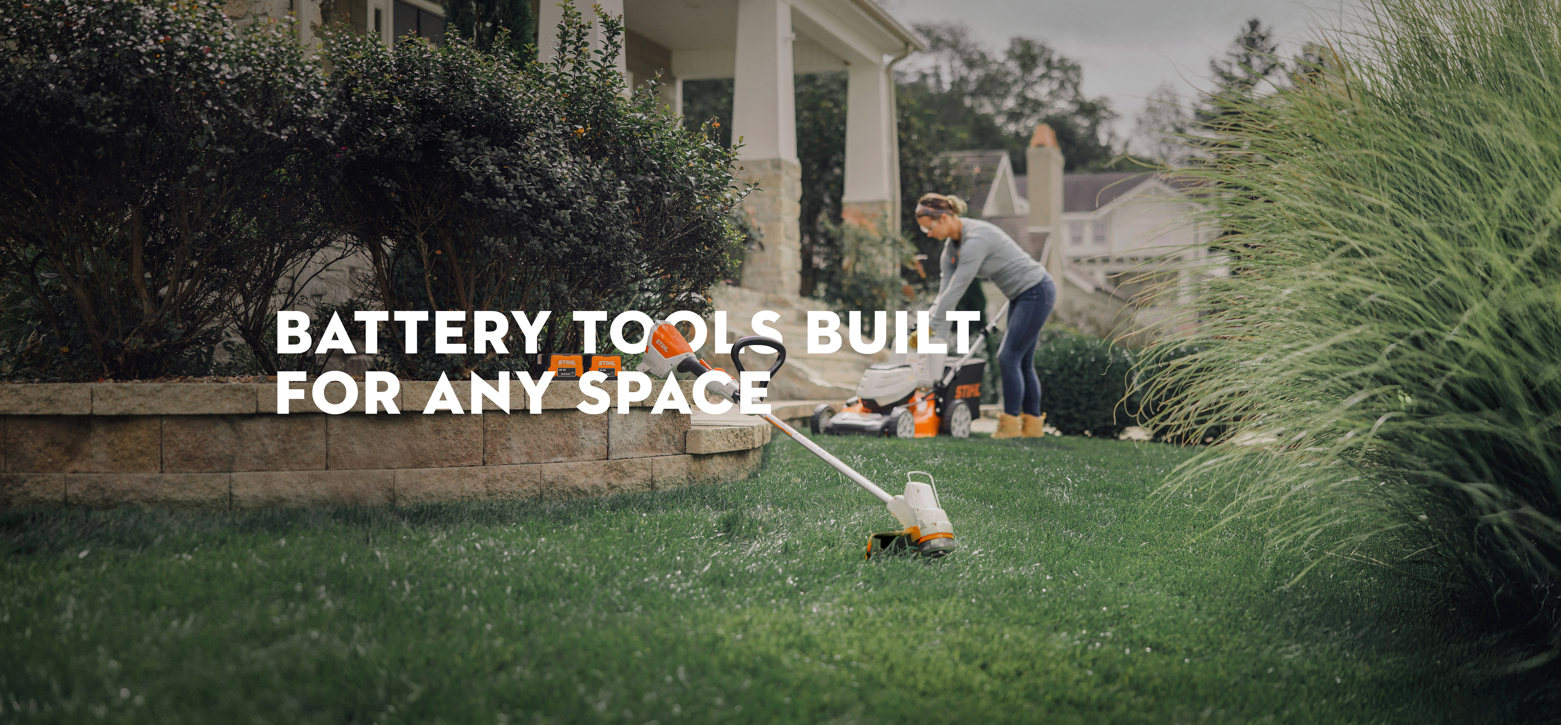 Products in the STIHL AK battery system showcased in yard