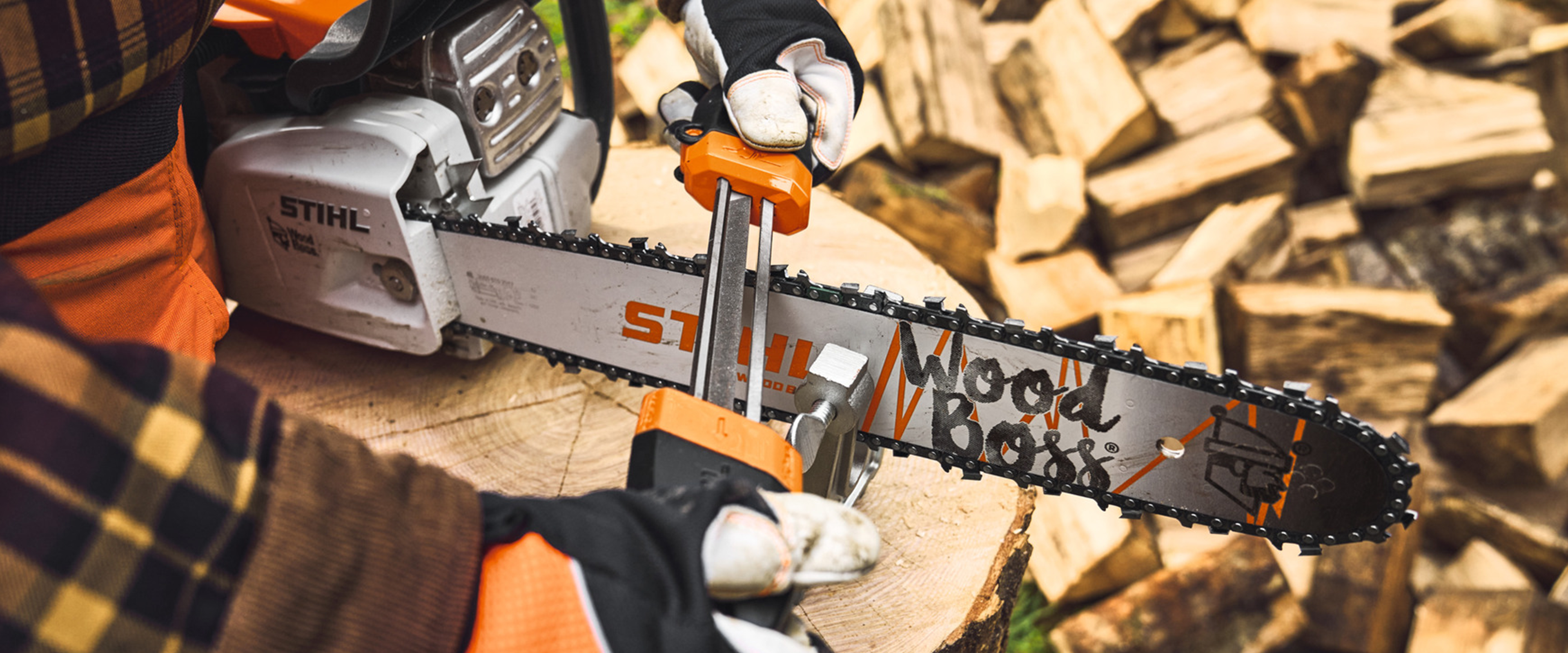 STIHL chainsaw being sharpened with a file