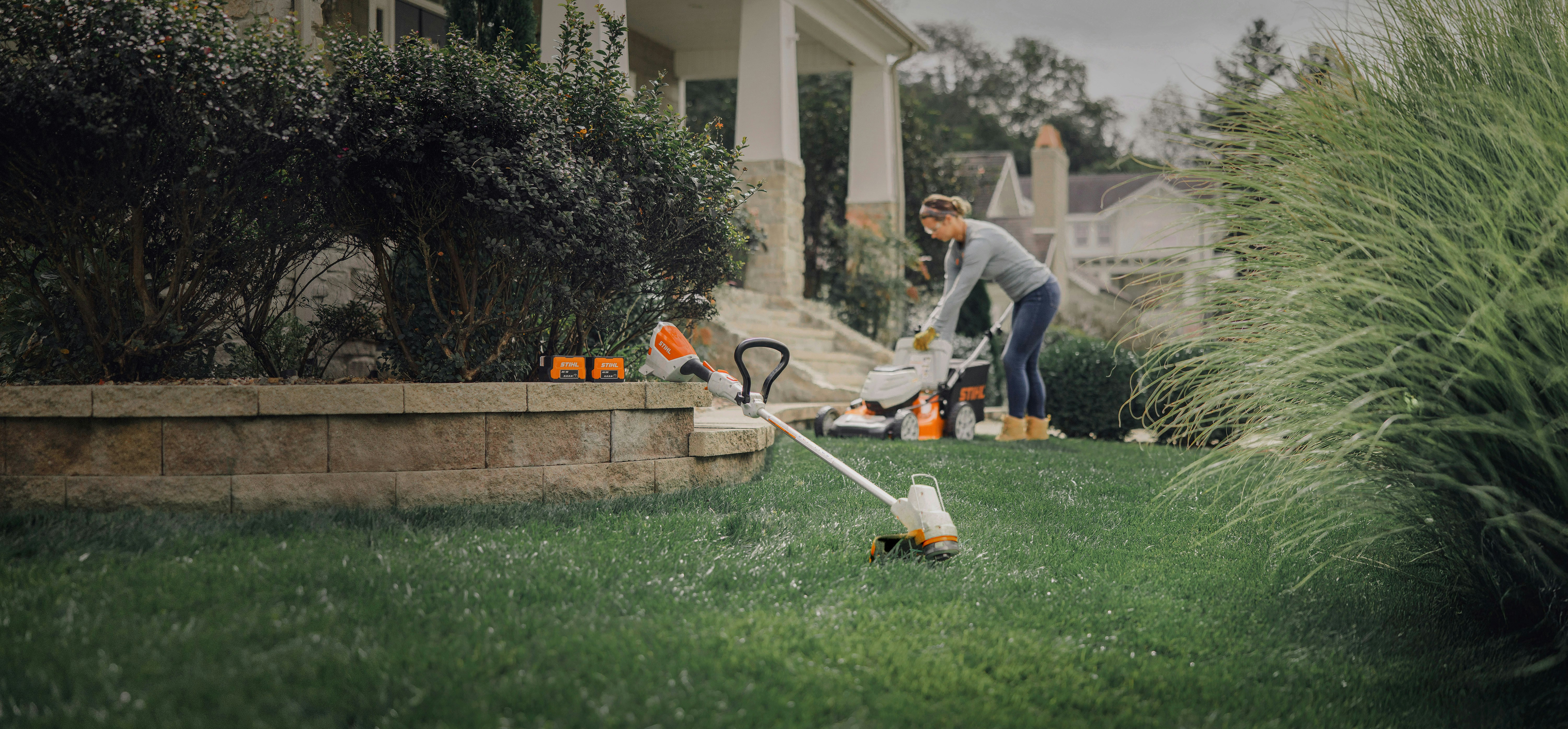 Products in the STIHL AK battery system showcased in yard
