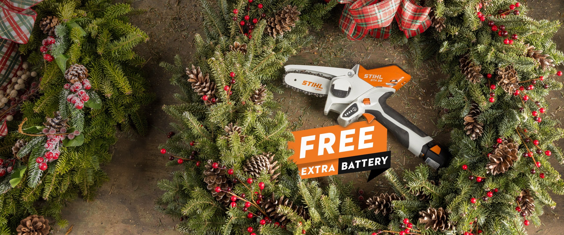 STIHL GTA 26 in the of a wreath with "Free Extra Battery" logo