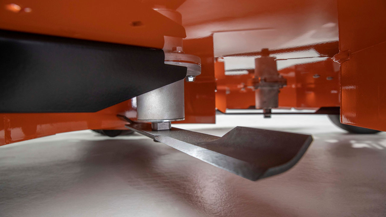 MARBAIN hardened mower blade under a STIHL zero-turn mower deck.