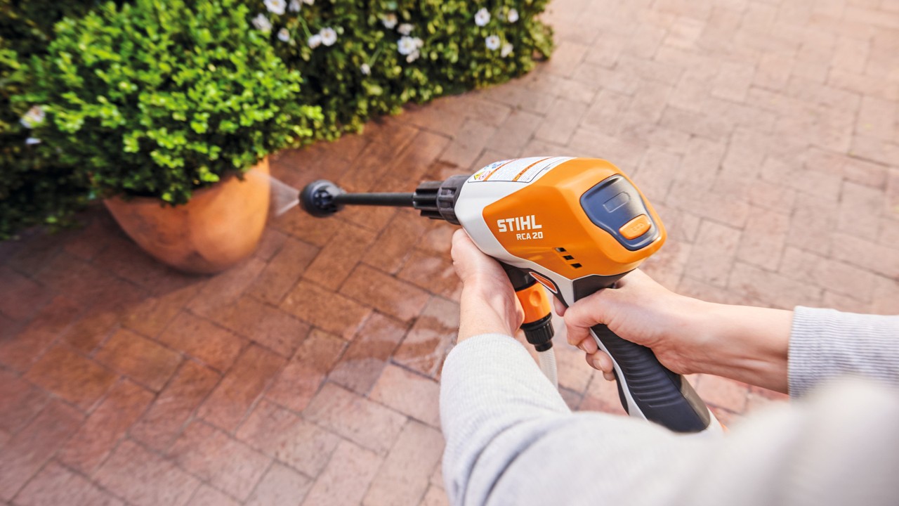 STIHL handheld battery-powered sprayer used on a patio